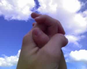 Jake's little hand folded in my hand in prayer.