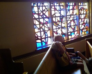 Spencer and Jake in a pew at our Church.