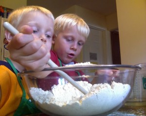 Spencer and Jake stirring the bread mix.