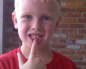 Spencer lost his first tooth.