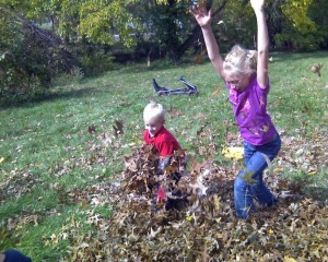 Anna and Jake playing in the leaves