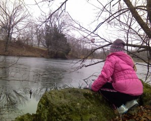 Anna pausing to look at the ice covered pond