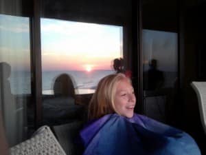 Anna witnessing her first sunrise over the ocean 3 years ago