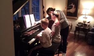 My aunt teaching my children with her kind and gentle way to play piano
