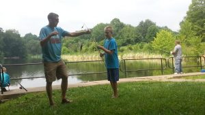 My husband and son with a catch
